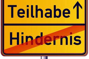 Foto zeigt ein Ortsschild mit dem Hinweis in Richtung 