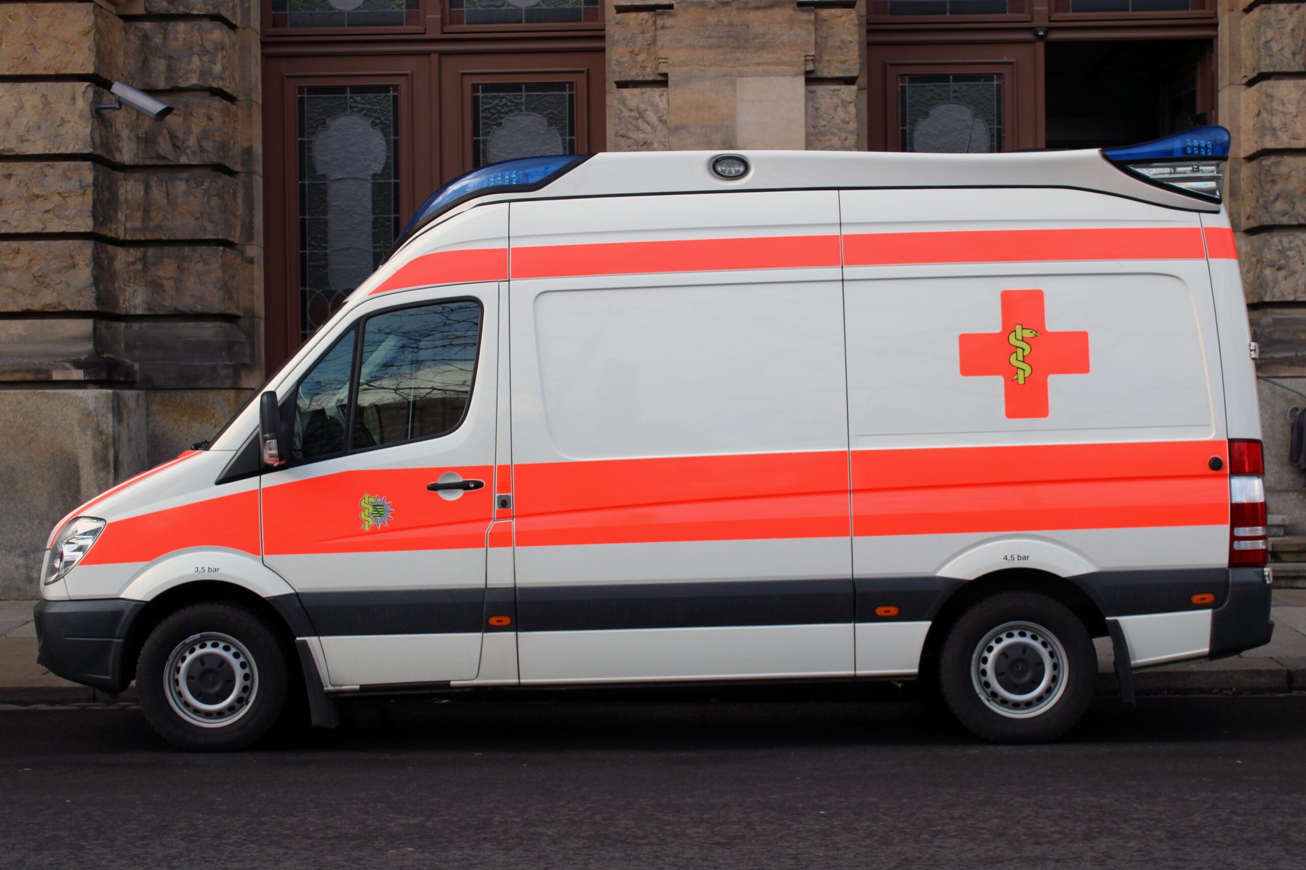 Side view of an ambulance parked outdoors in Dresden, Germany.